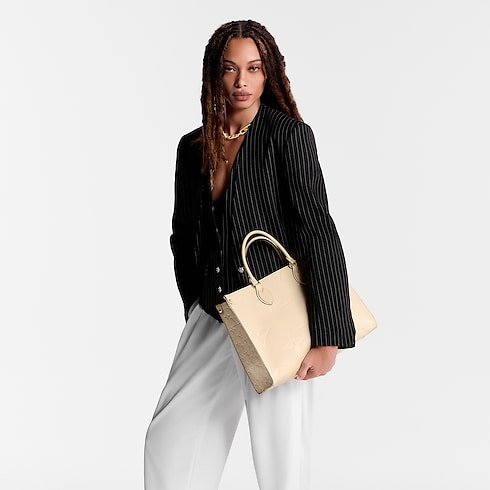 Monogram Empreinte Leather Handbags All Collections OnTheGo MM | Louis Vuitton ® (Product zoom)