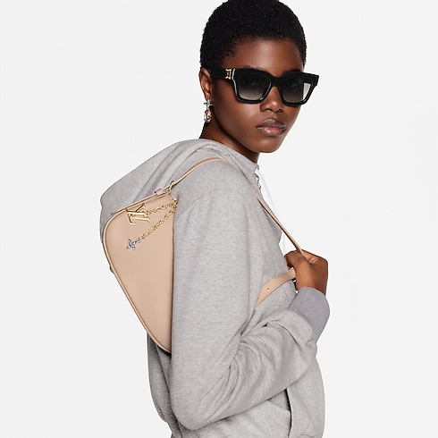 H36 Small Leather Goods Wallets on Chain and Nano Bags Pochette LV Bloom | Louis Vuitton ® (Product zoom)